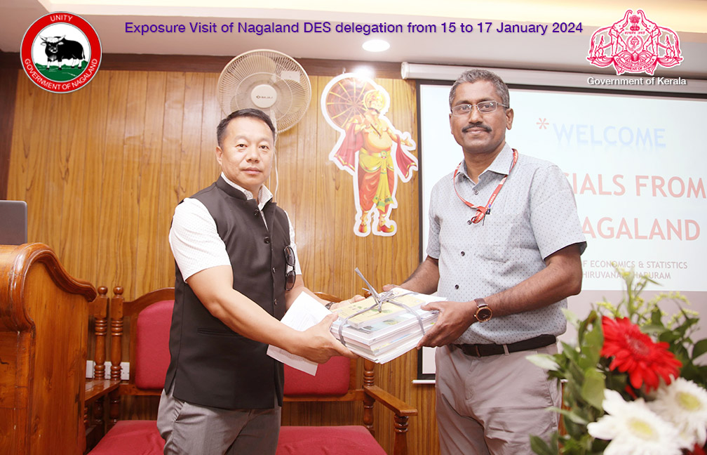 Director DES is handing over a set of latest reports of Kerala to Nagaland Director