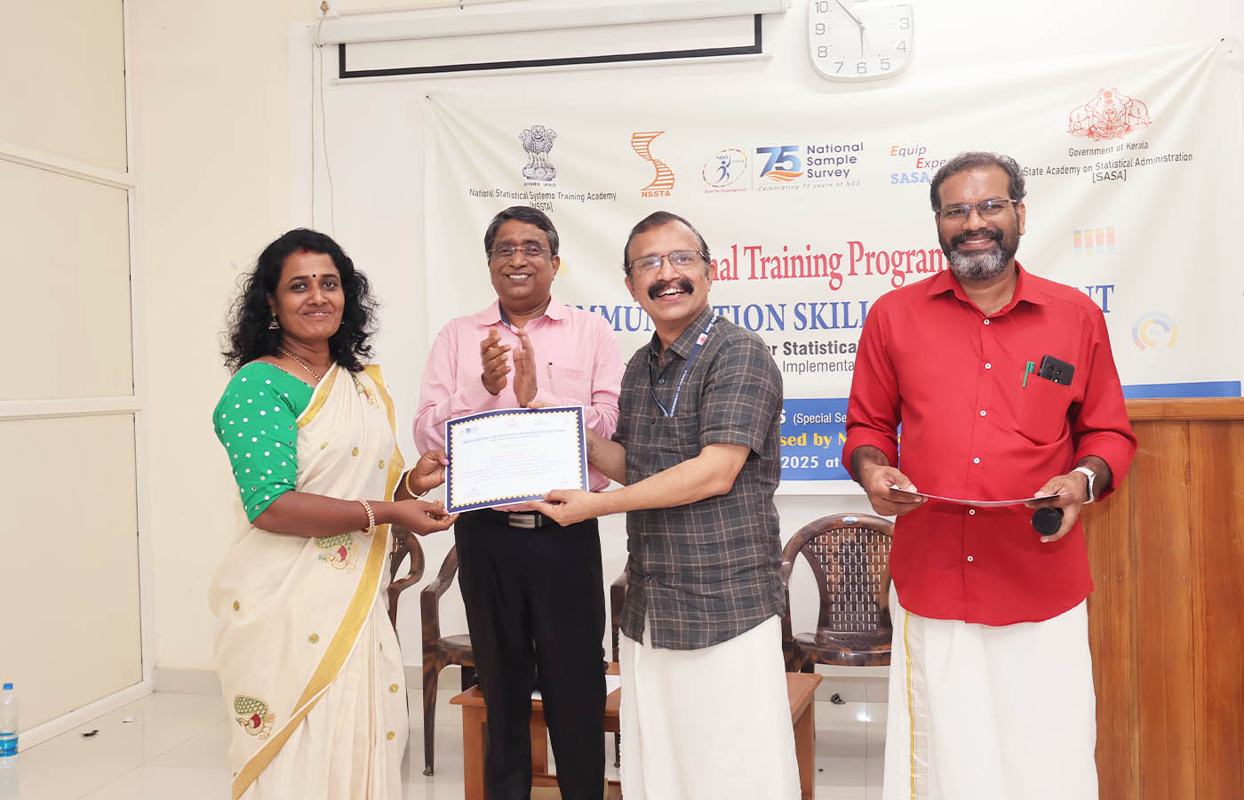 Presenting certificate to Smt. Rajani V S, Senior Statistical Officer, NSO (FOD) SRO Kollam, Kerala.